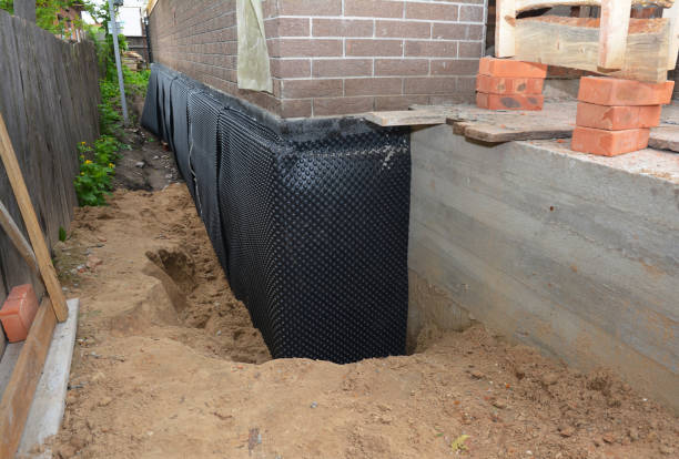 Happy homeowners after waterproofing job in Towson